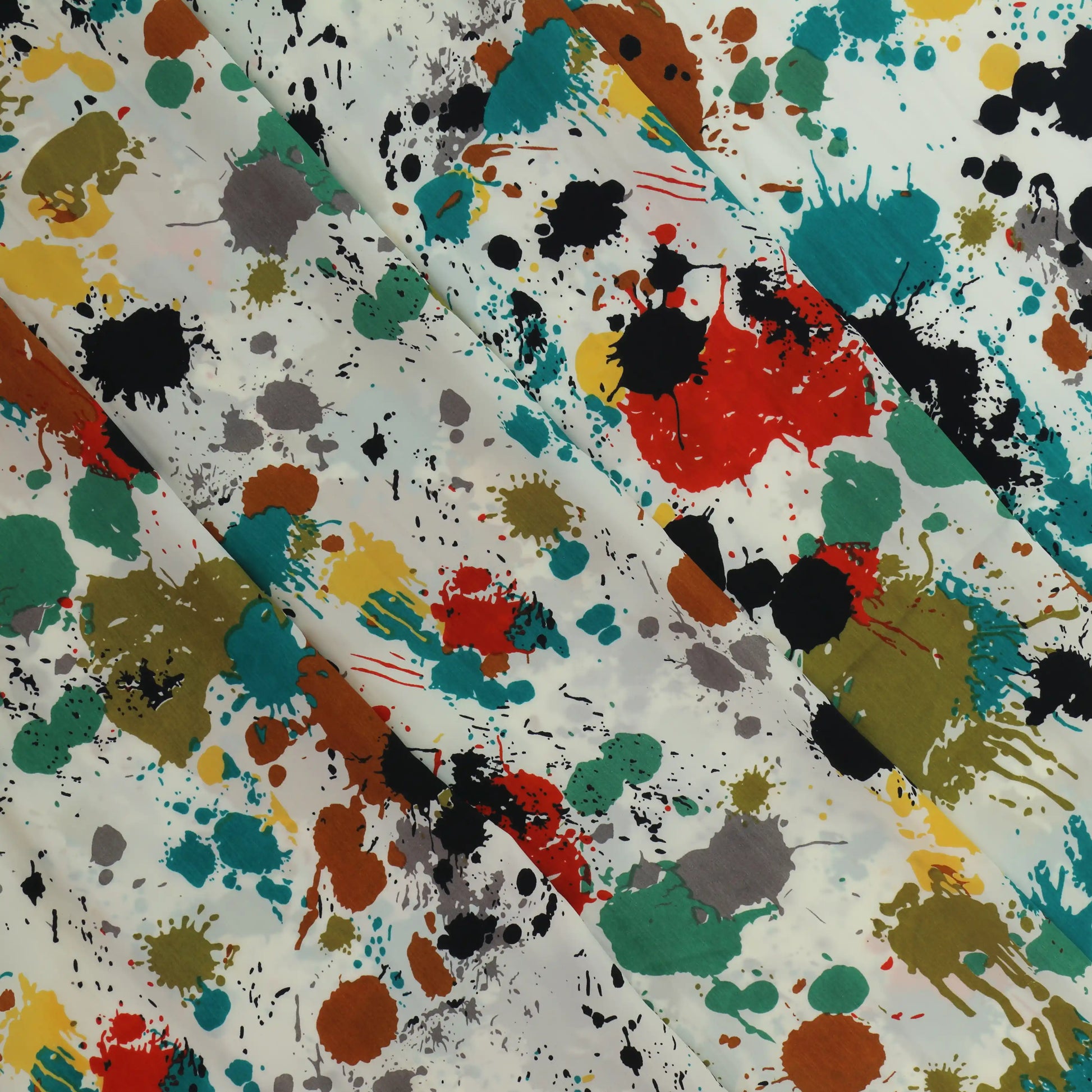 paint-splatter-polyester-peach-skin-fabric – close-up showing weave and surface detail
