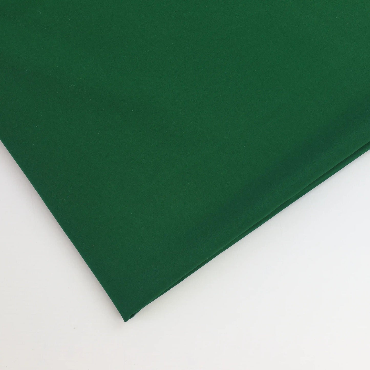 green-polyester-faux-silk-fabric – close-up of colour, pattern and texture