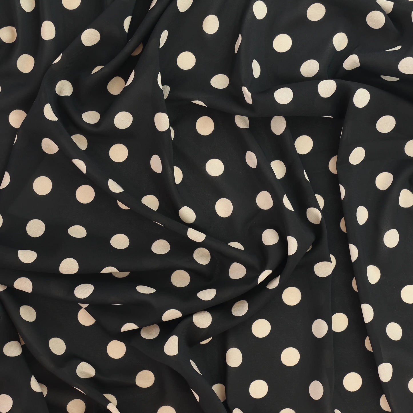 black-&-cream-polka-dot-chiffon-fabric – close-up showing weave and surface detail