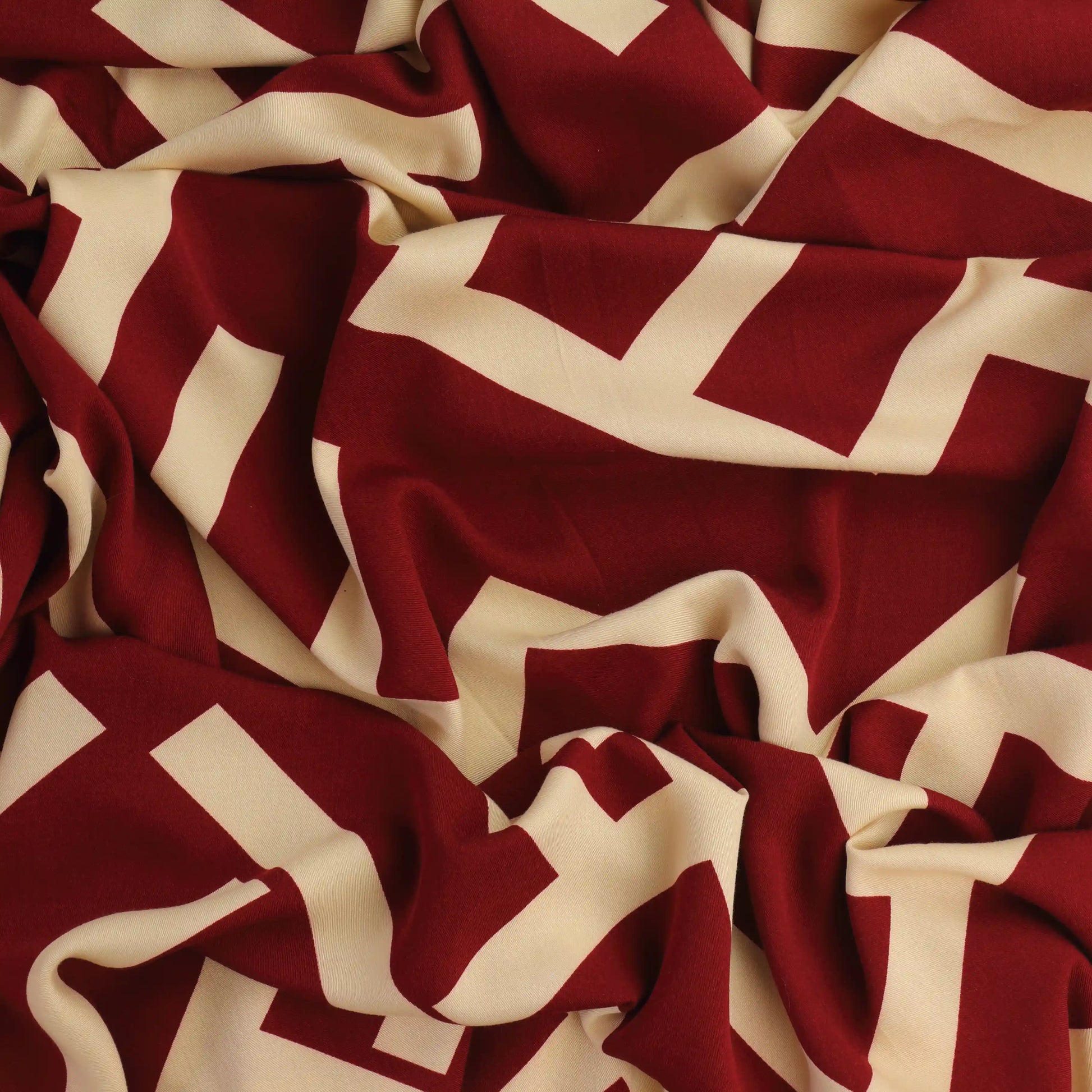 burgundy-&-cream-viscose-twill-fabric – close-up showing weave and surface detail