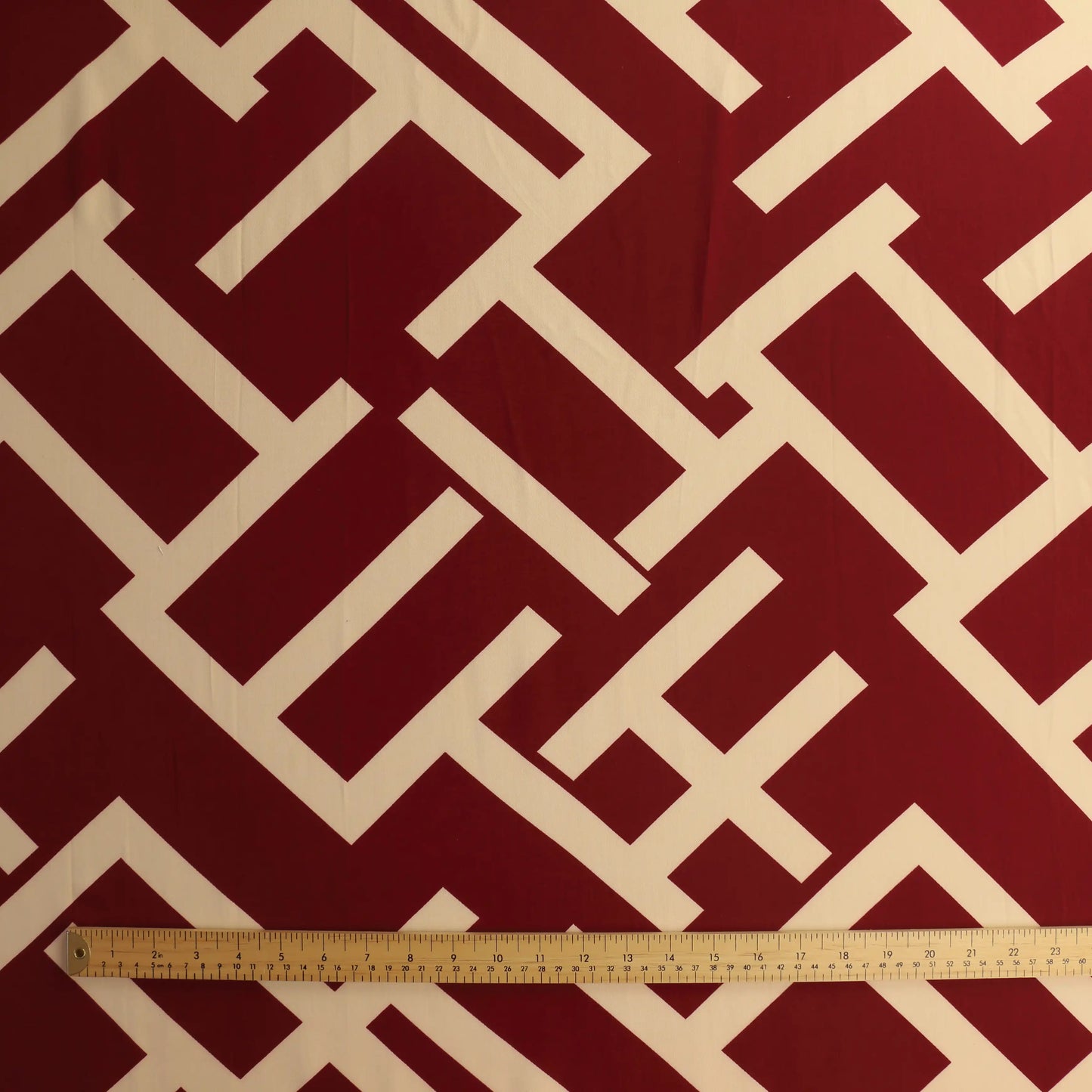 burgundy-&-cream-viscose-twill-fabric – product laid flat showing its colour and pattern