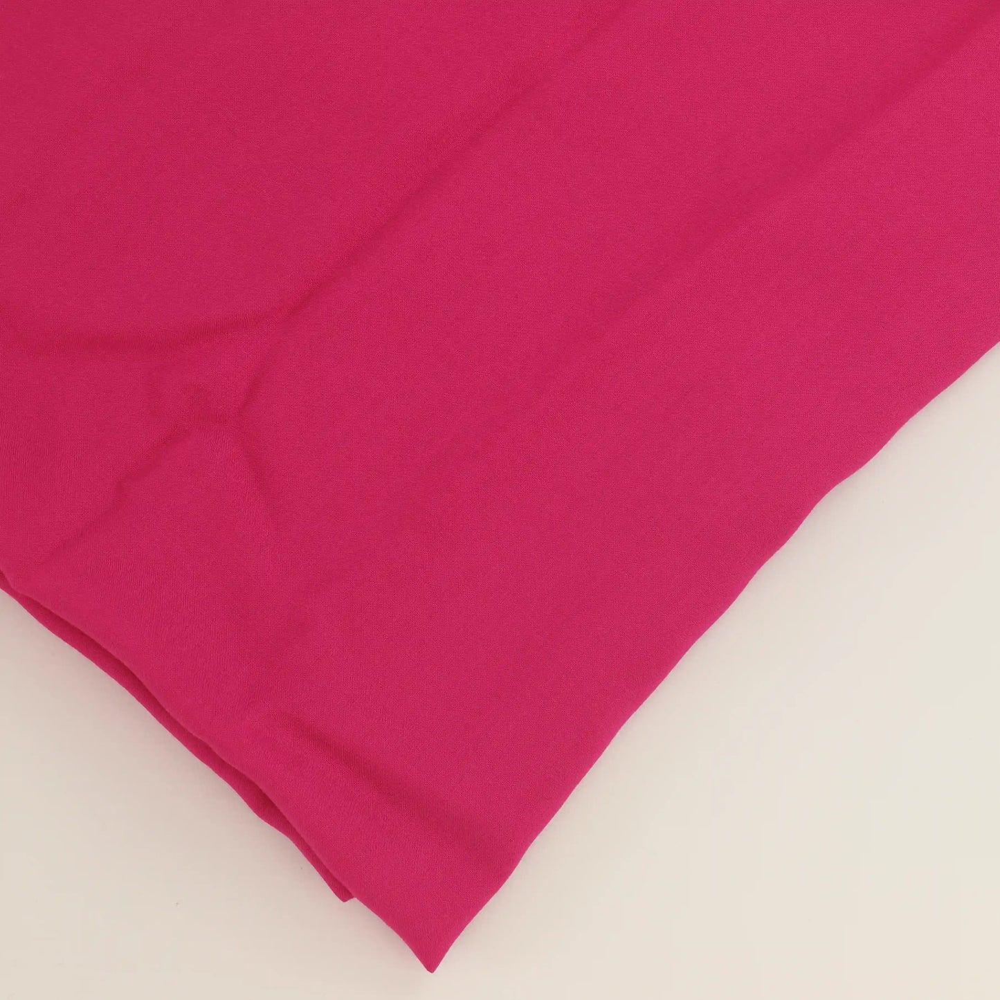 hot-pink-viscose-twill-fabric – close-up of colour, pattern and texture