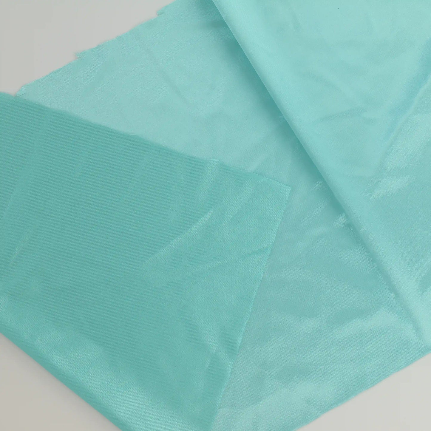 turquoise-duoplex-bra-lining-fabric – close-up showing weave and surface detail