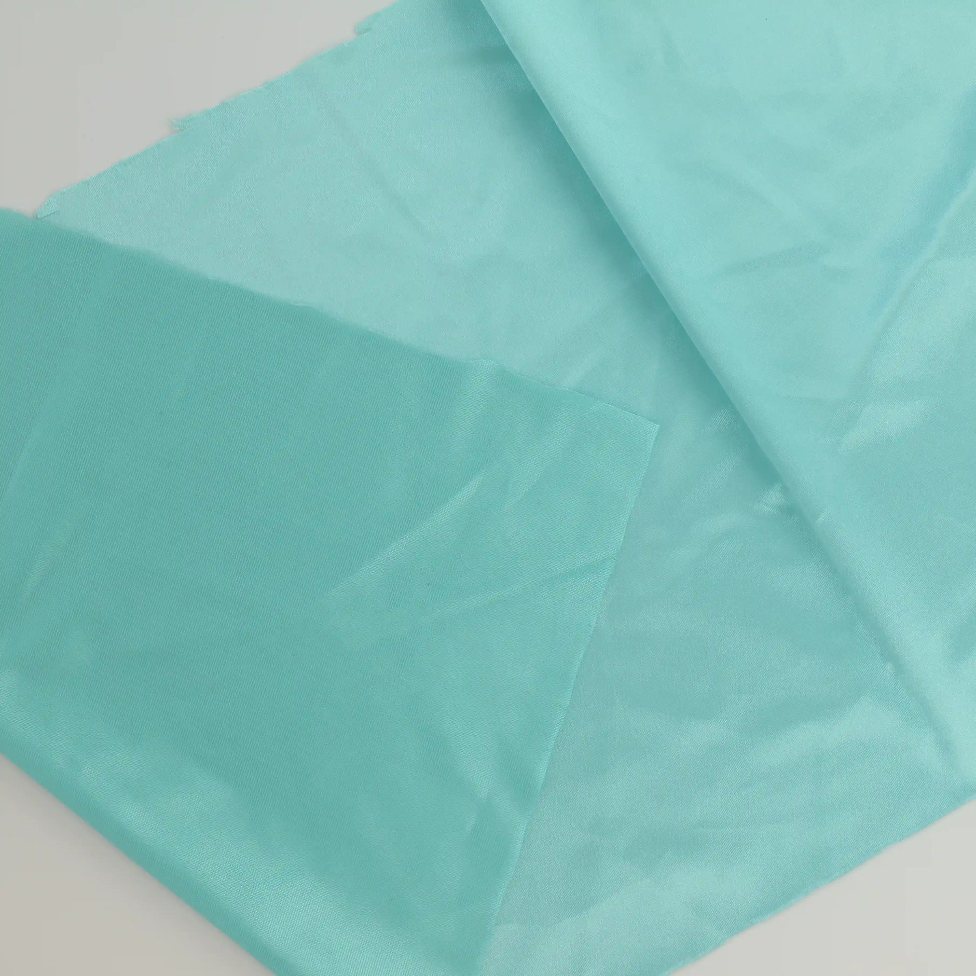 turquoise-duoplex-bra-lining-fabric – close-up showing weave and surface detail