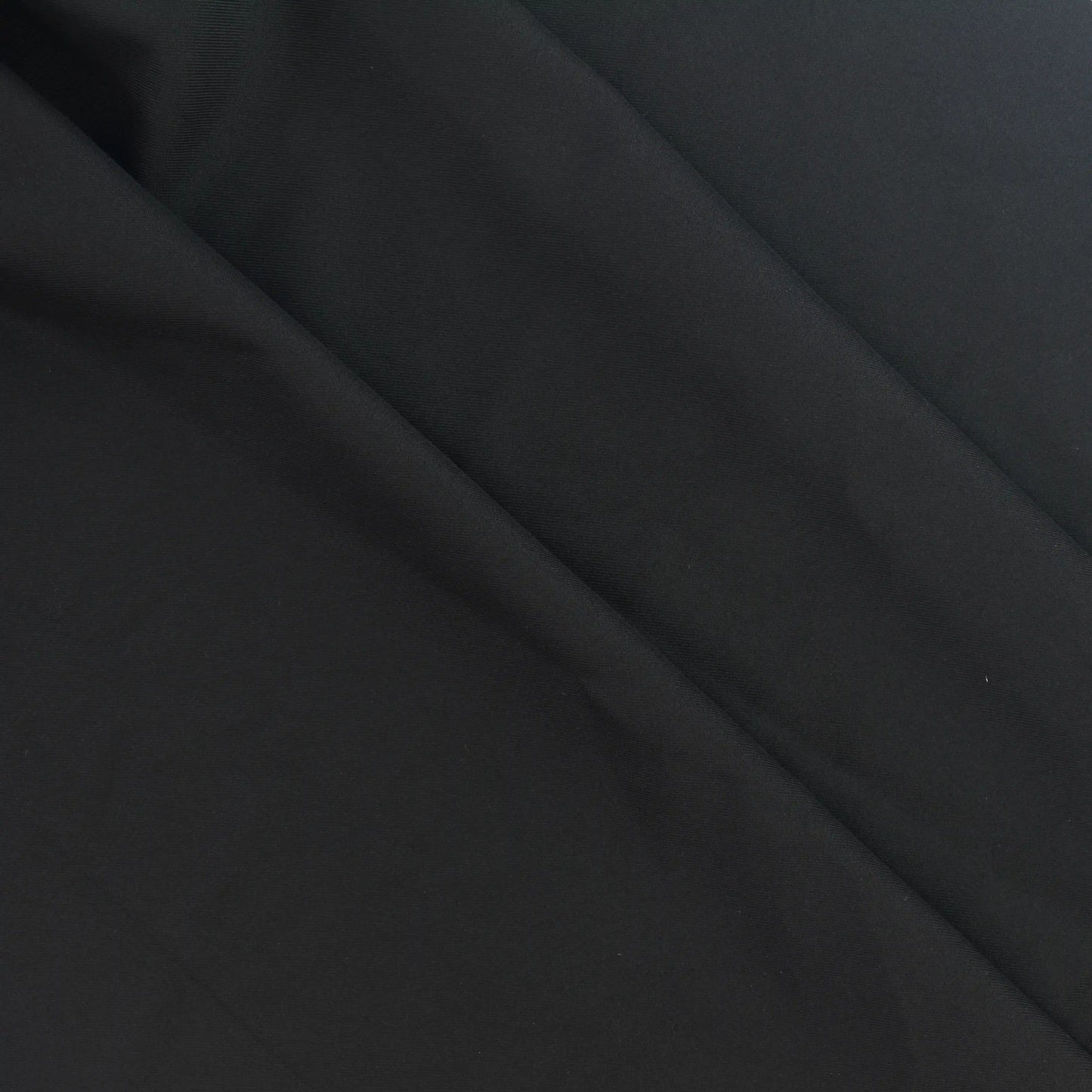 black-polyester-twill-fabric-remnant – product laid flat showing its colour and pattern