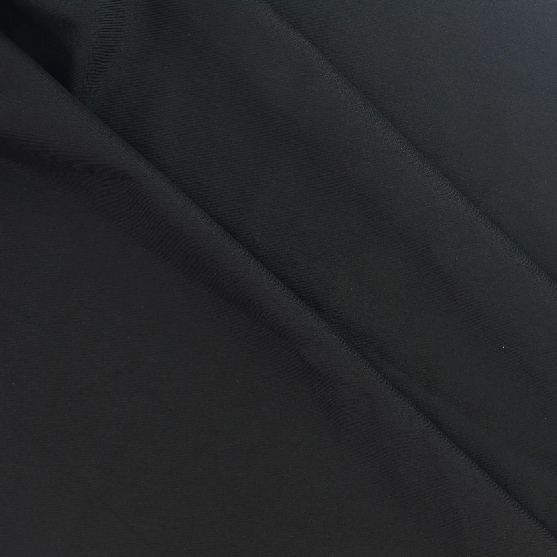 black-polyester-twill-fabric-remnant – product laid flat showing its colour and pattern