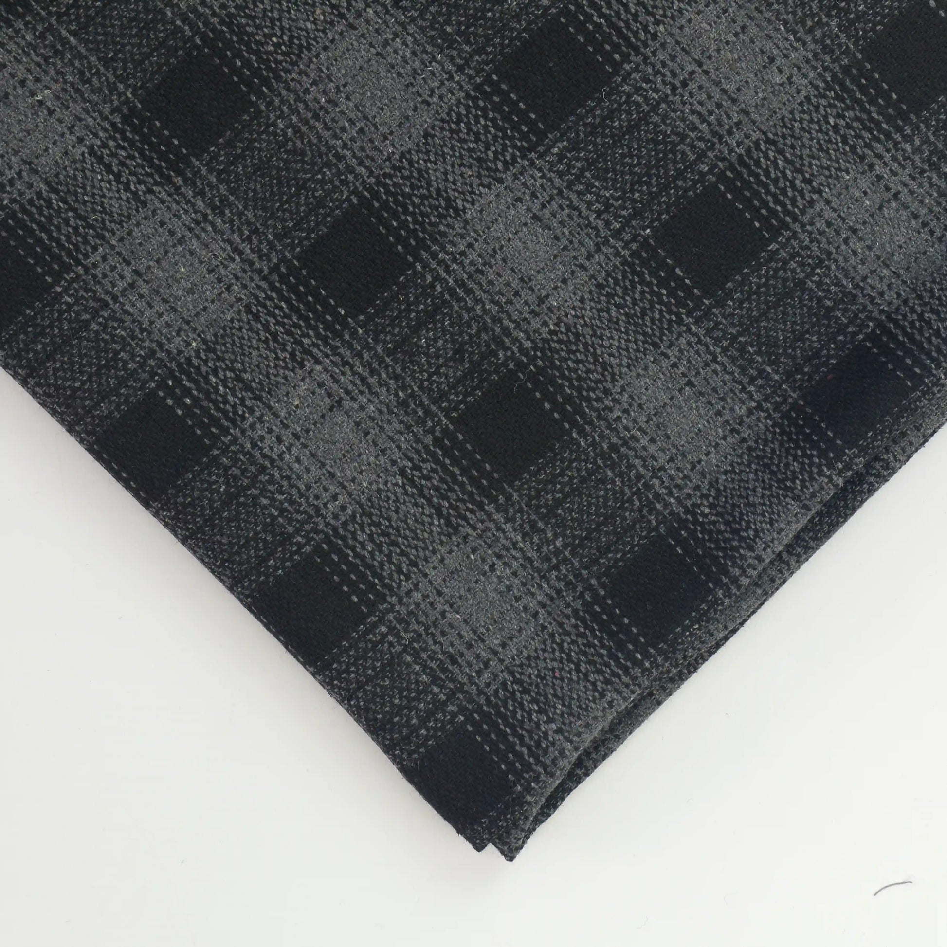 black-and-gray-checked-suiting-fabric – close-up of colour, pattern and texture