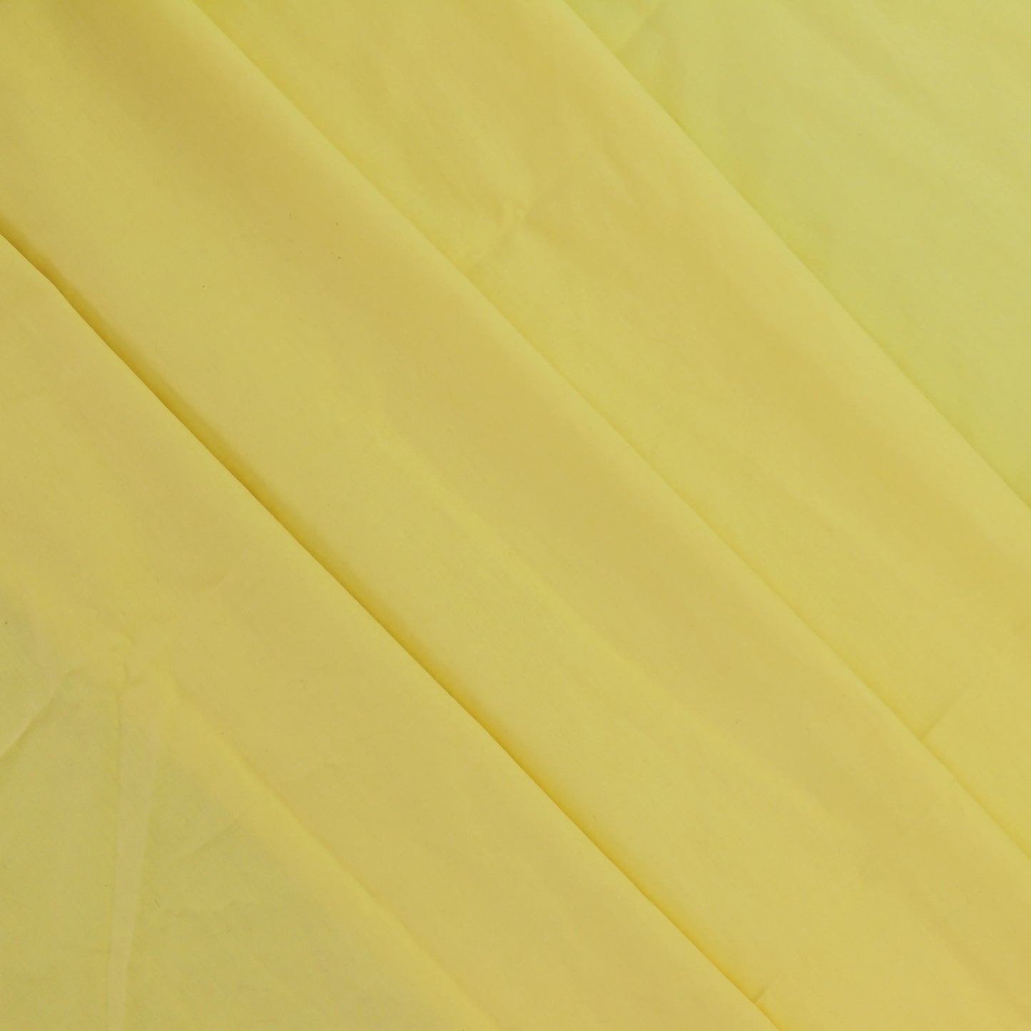 yellow-polycotton-broadcloth-fabric – close-up of colour, pattern and texture