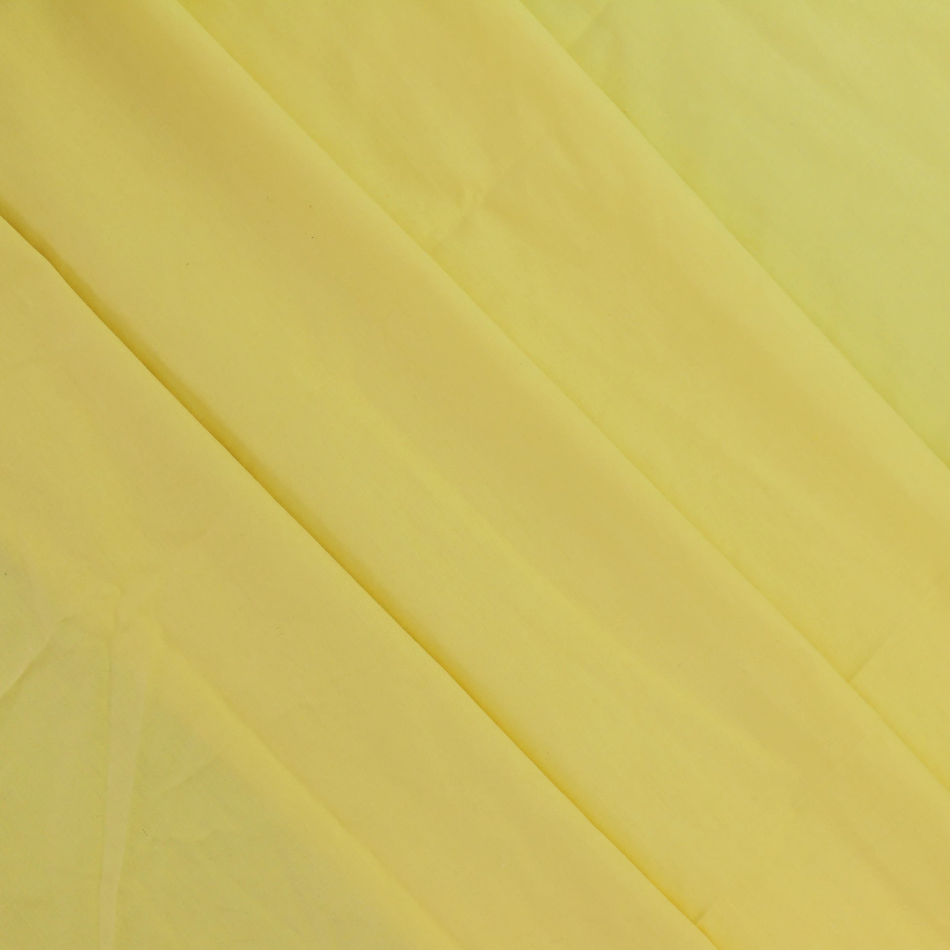 yellow-polycotton-broadcloth-fabric – close-up of colour, pattern and texture