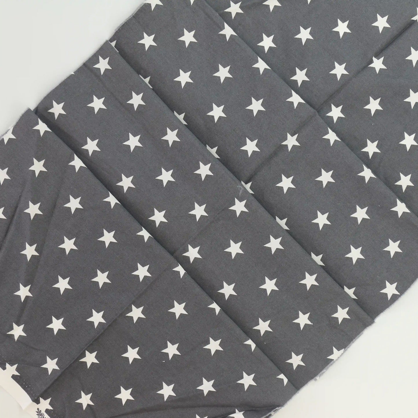 gray-&-white-star-print-cotton – product laid flat showing its colour and pattern