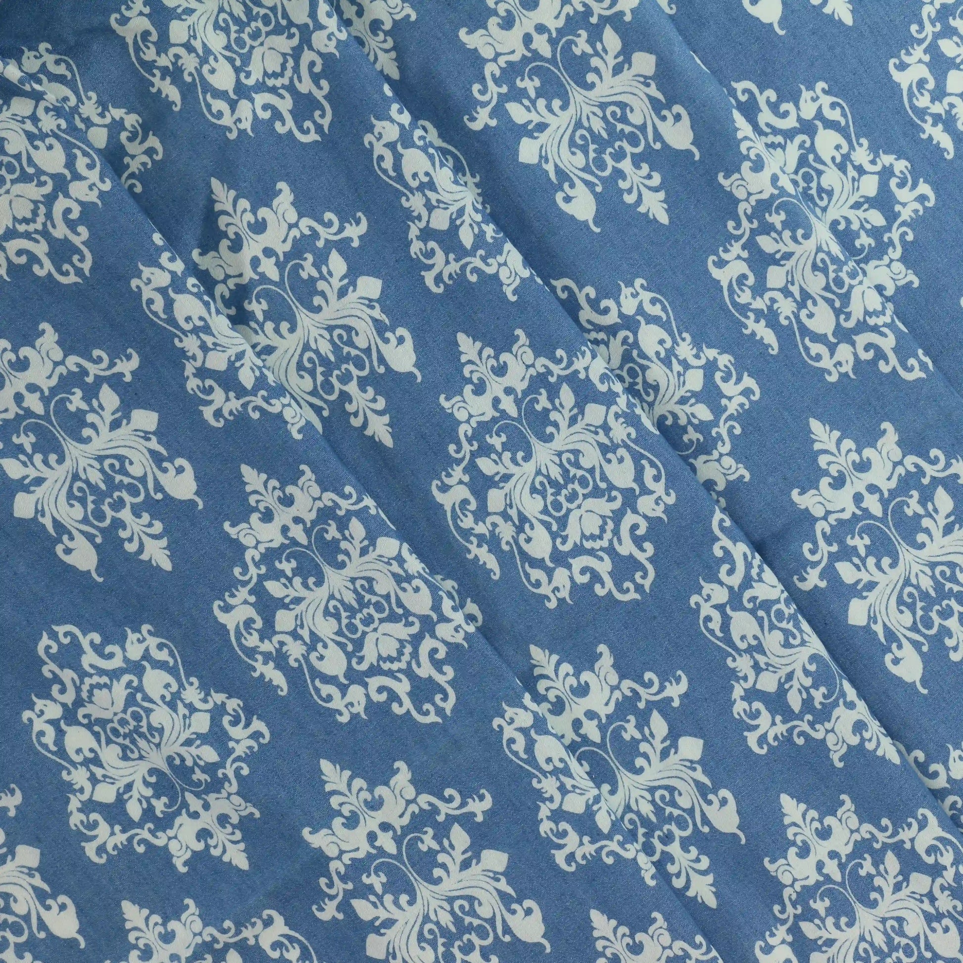 blue-&-white-damask-pattern-chambray-fabric – product laid flat showing its colour and pattern
