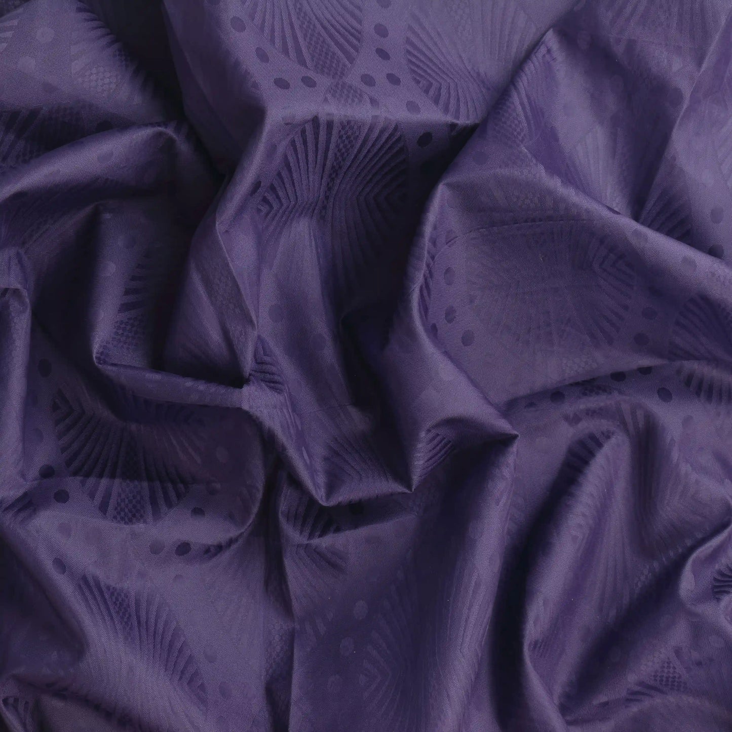 purple-patterned-polyester-fabric – close-up of colour, pattern and texture