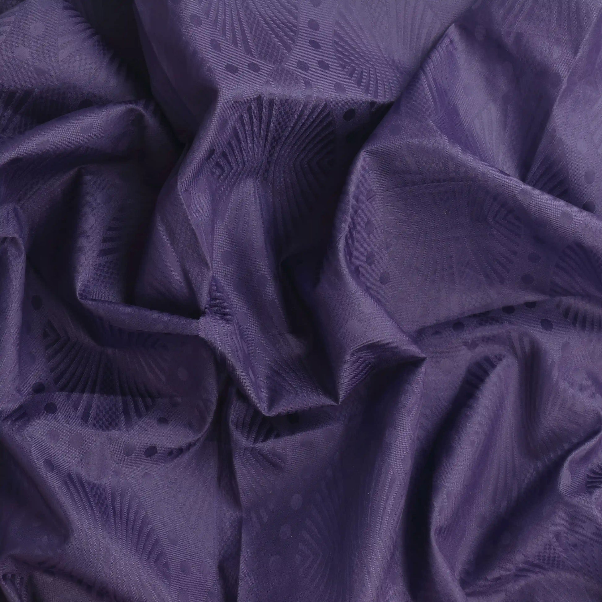 purple-patterned-polyester-fabric – close-up of colour, pattern and texture