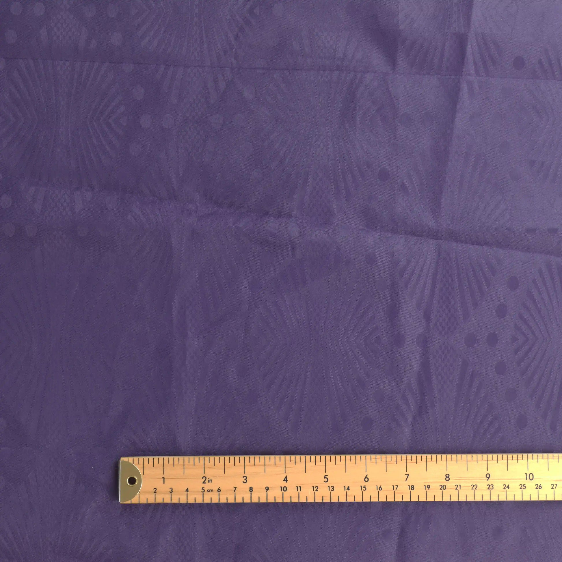 purple-patterned-polyester-fabric – product laid flat showing its colour and pattern
