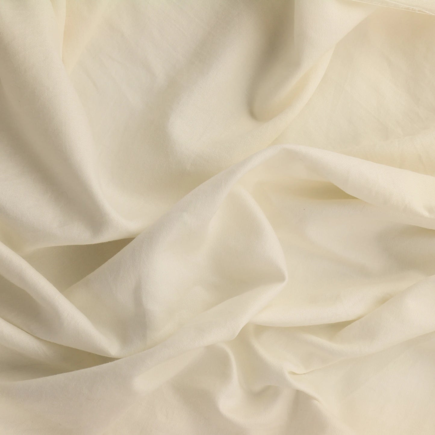 off-white-cotton-sateen-fabric – product laid flat showing its colour and pattern