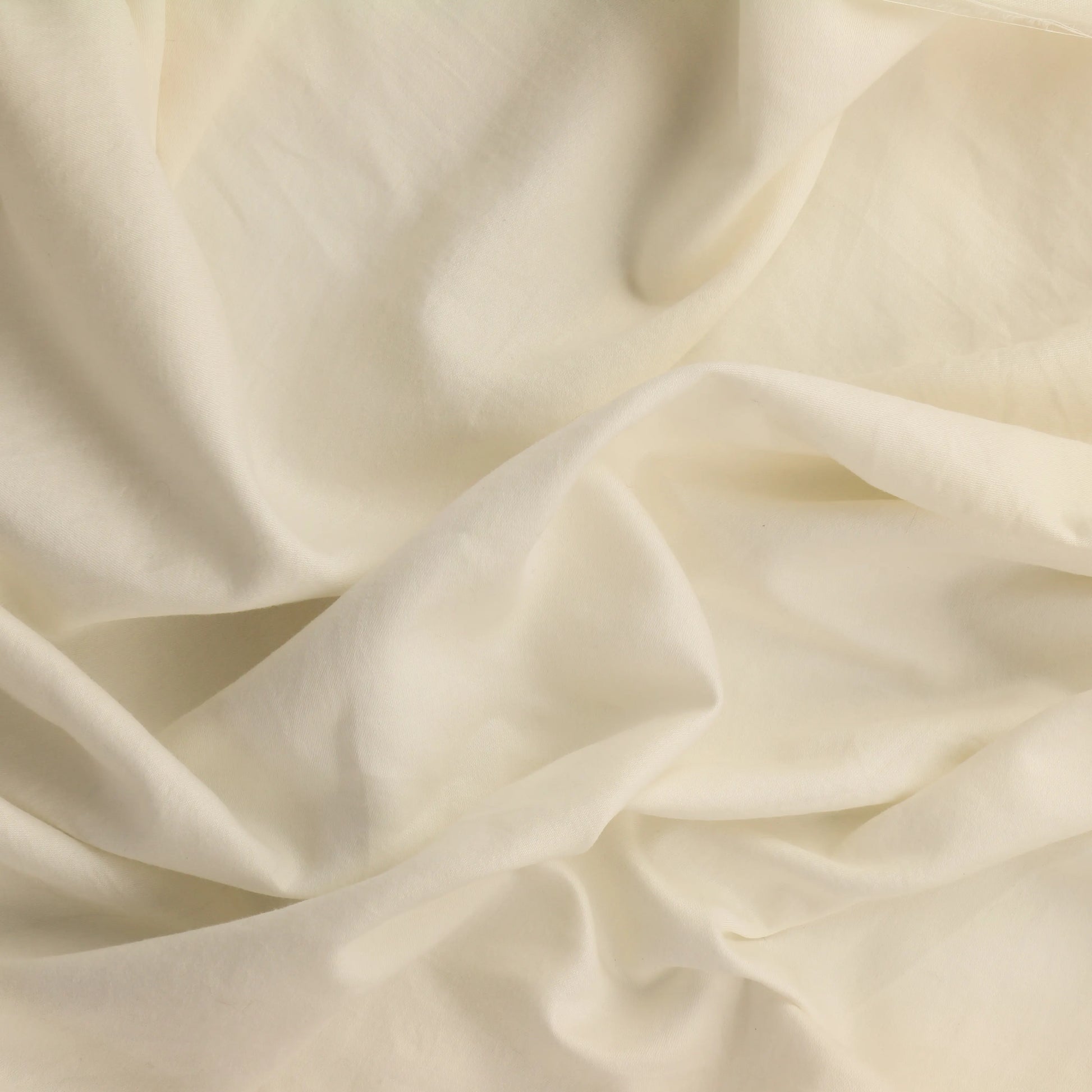 off-white-cotton-sateen-fabric – product laid flat showing its colour and pattern