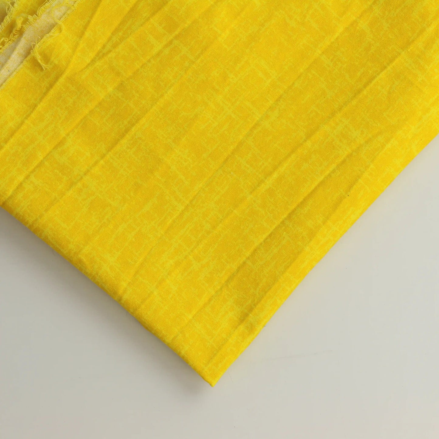 yellow-semi-solid-quilting-fabric – product laid flat showing its colour and pattern