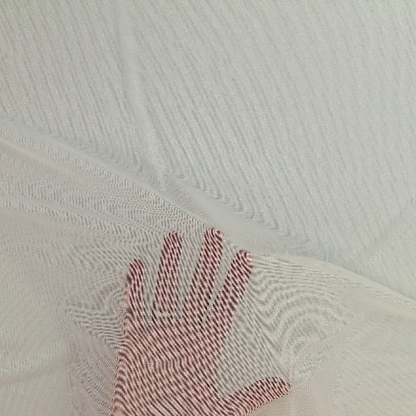 white-sheer-stretch-mesh-fabric – close-up of colour, pattern and texture