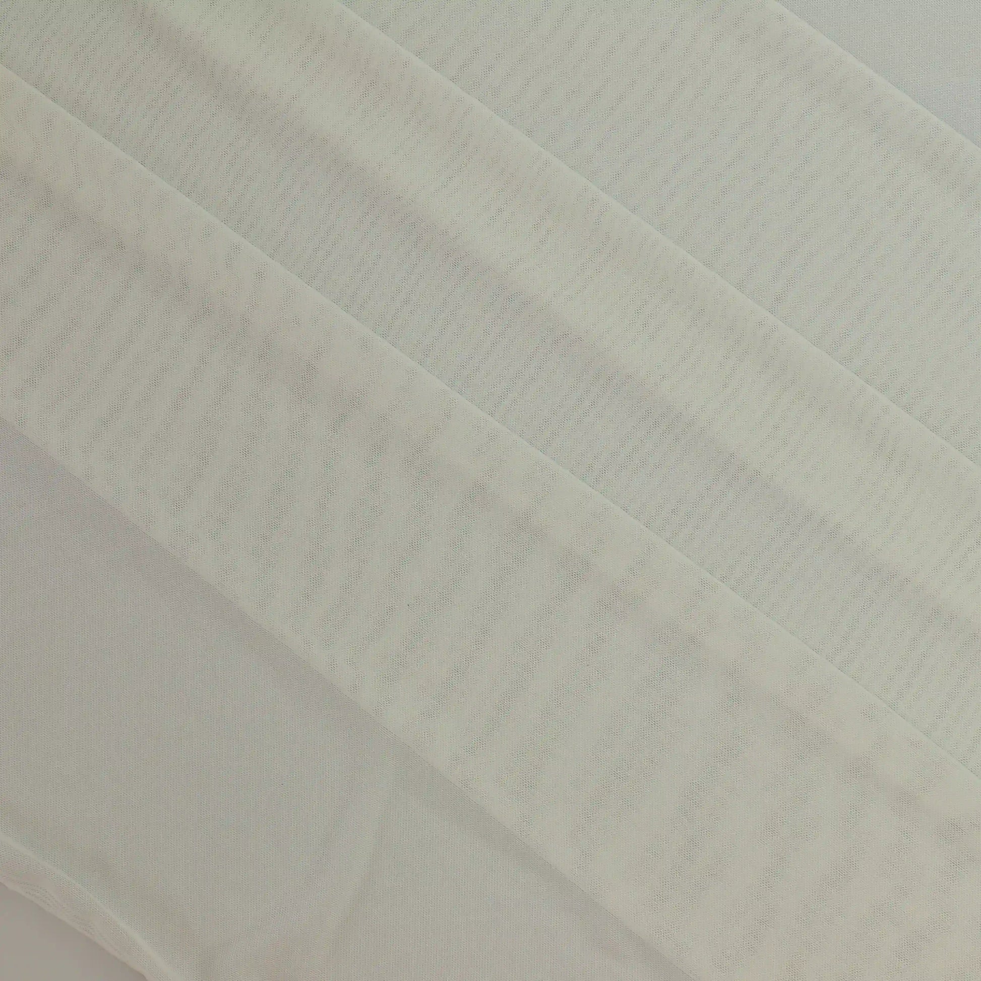 white-sheer-stretch-mesh-fabric – product laid flat showing its colour and pattern
