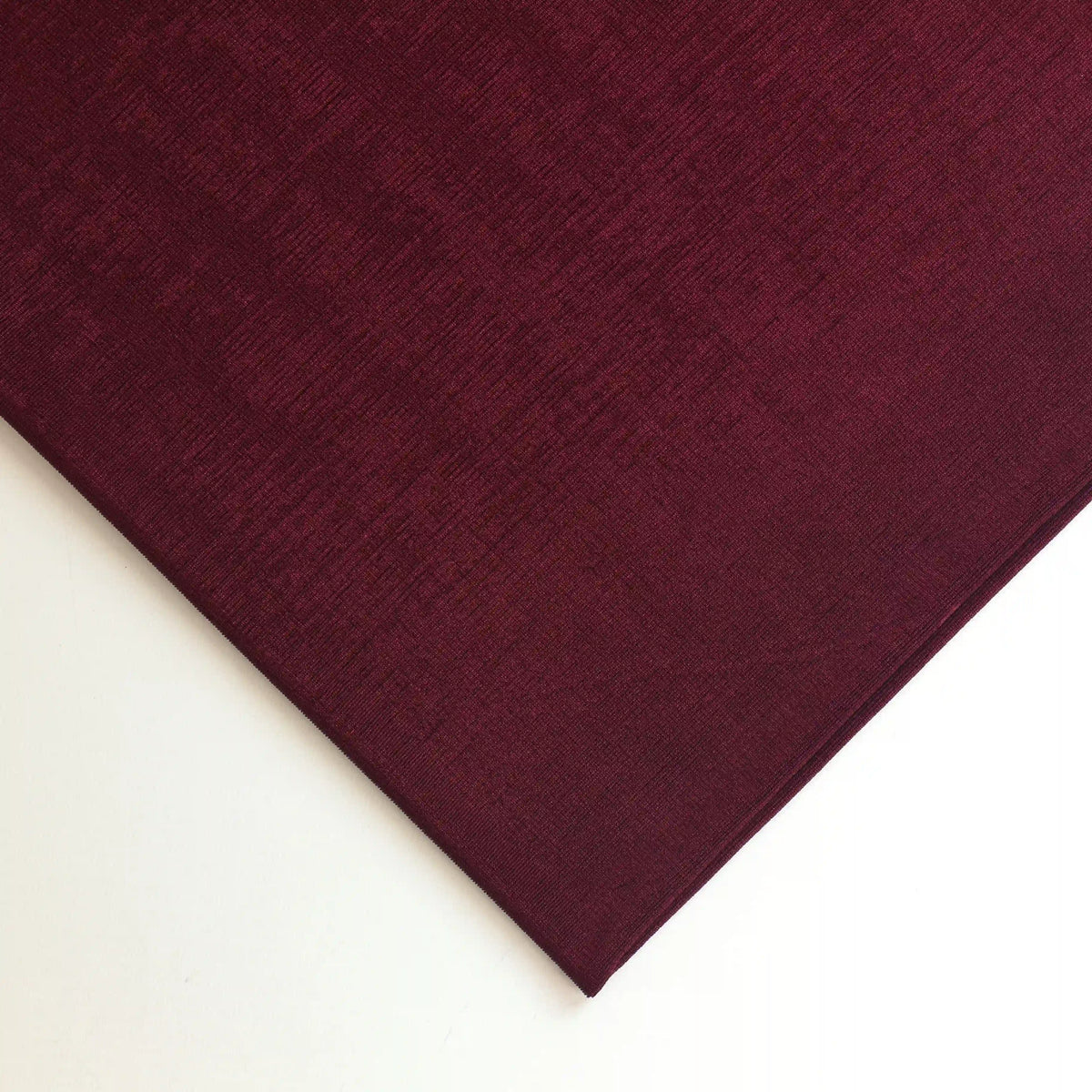 burgundy-polyester-jersey-dressmaking-fabric – close-up of colour and texture