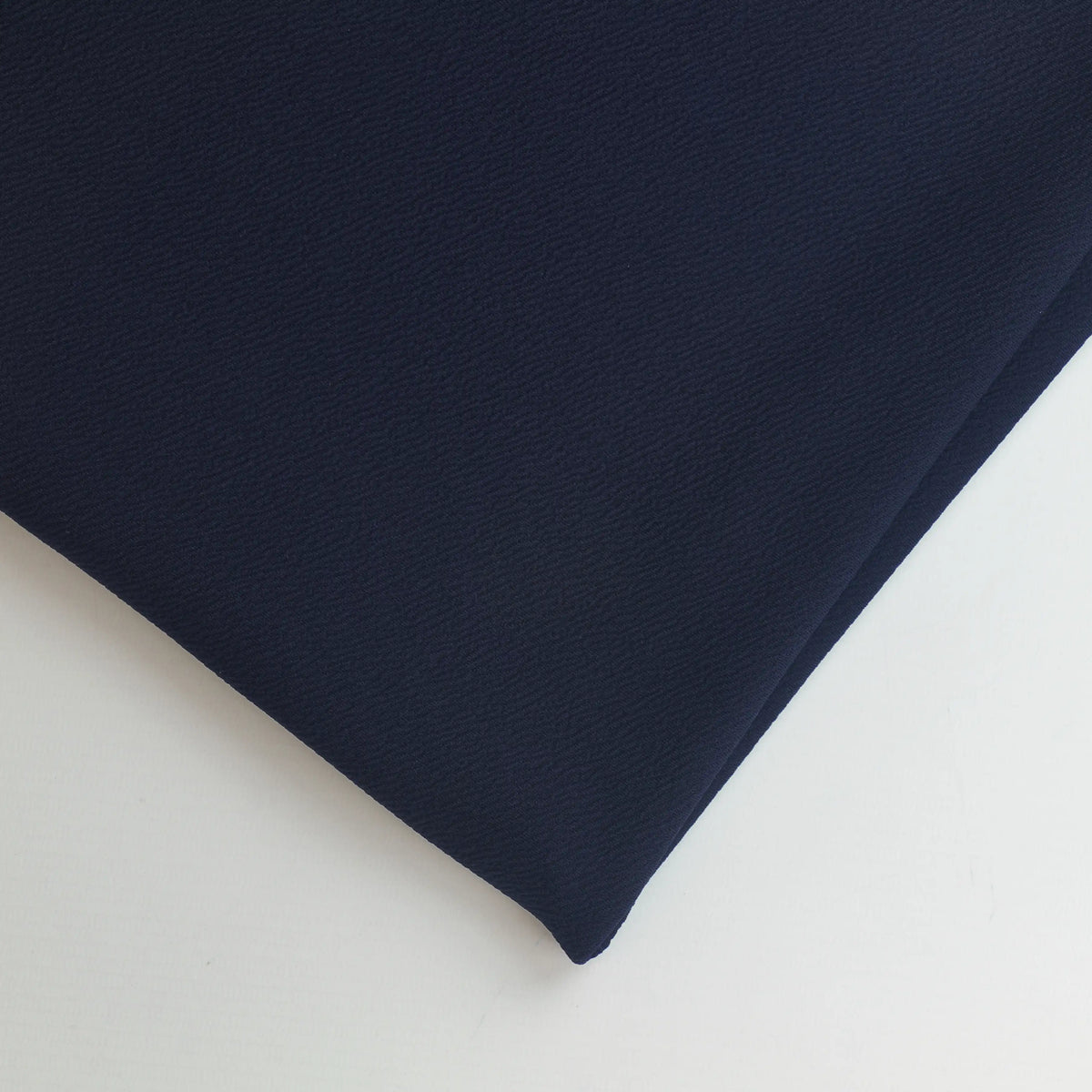navy-polyester-jersey-fabric – close-up of colour, pattern and texture