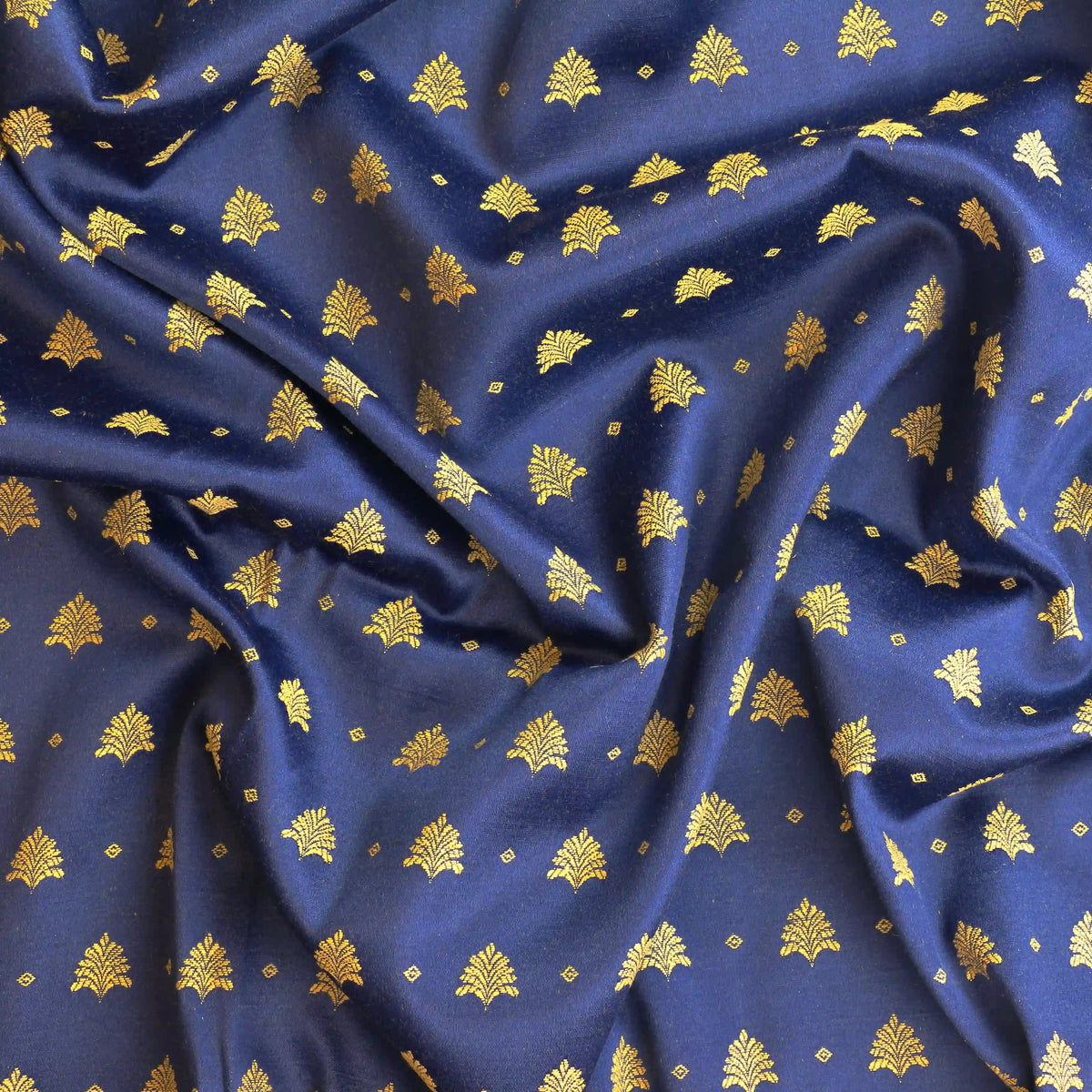 blue-&-gold-tree-print-jacquard – close-up of colour, pattern and texture