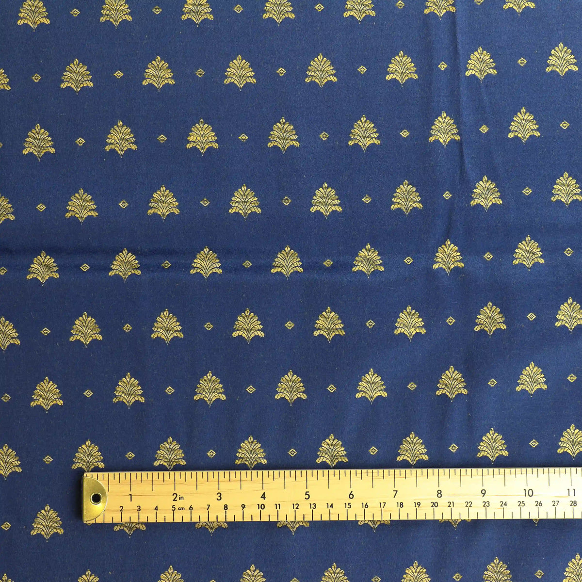 blue-&-gold-tree-print-jacquard – product gently folded showing its colour, texture and drape