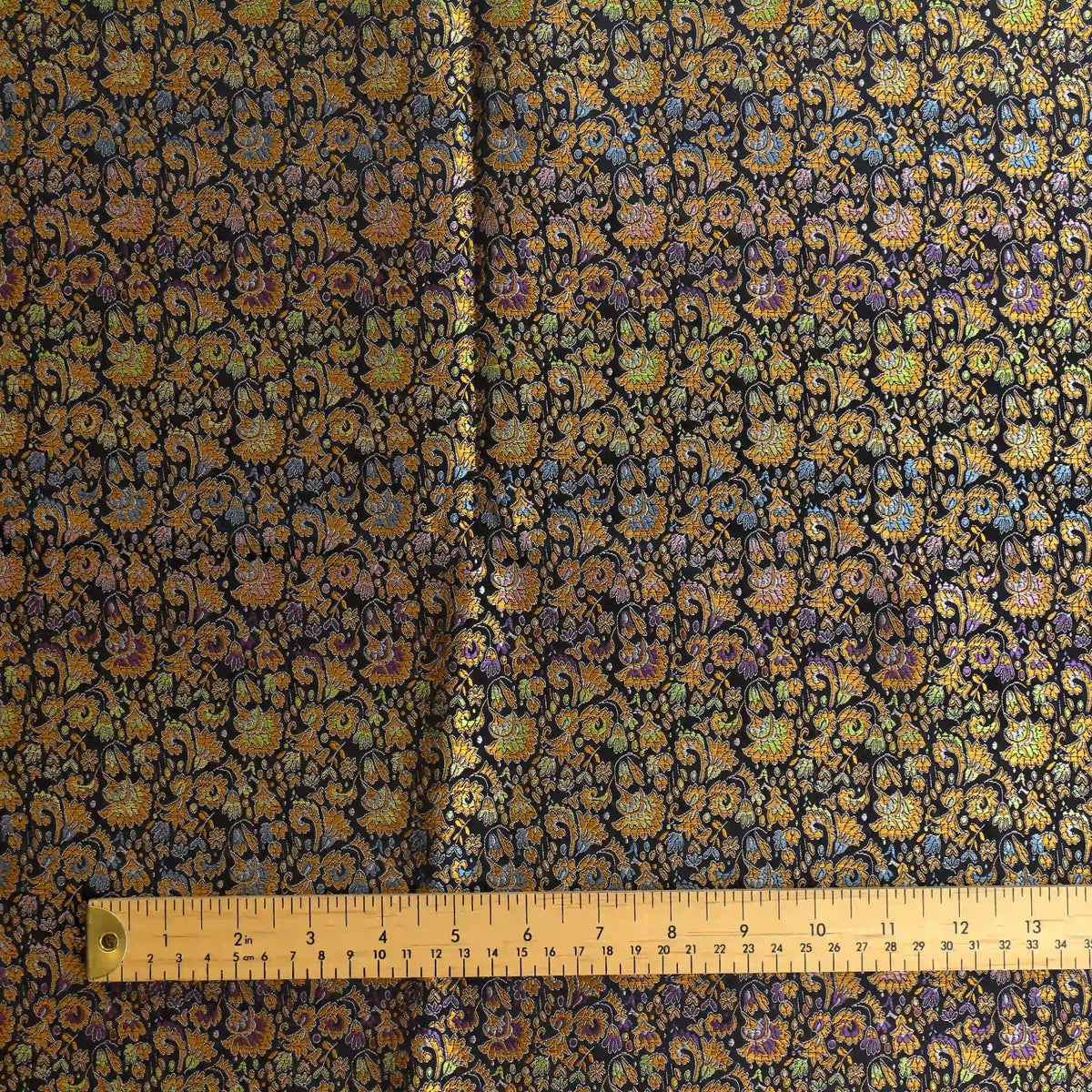 black,-bronze-&-multicolour-floral-brocade-fabric – product gently folded showing its colour, texture and drape