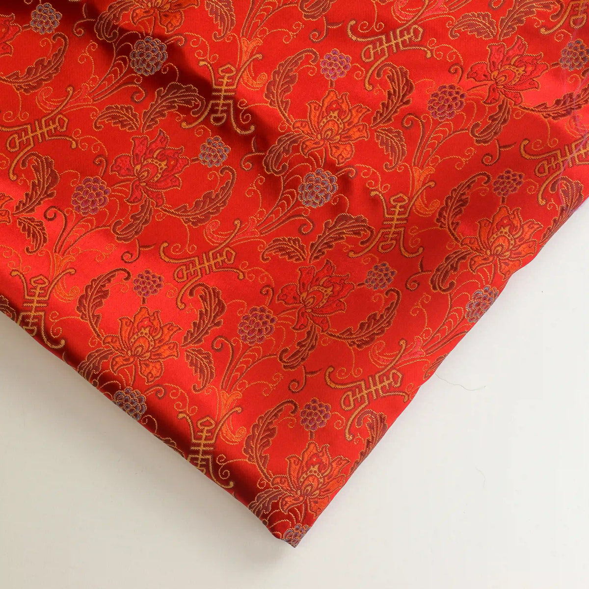 red-&-gold-floral-chinese-brocade-fabric – close-up showing weave and surface detail