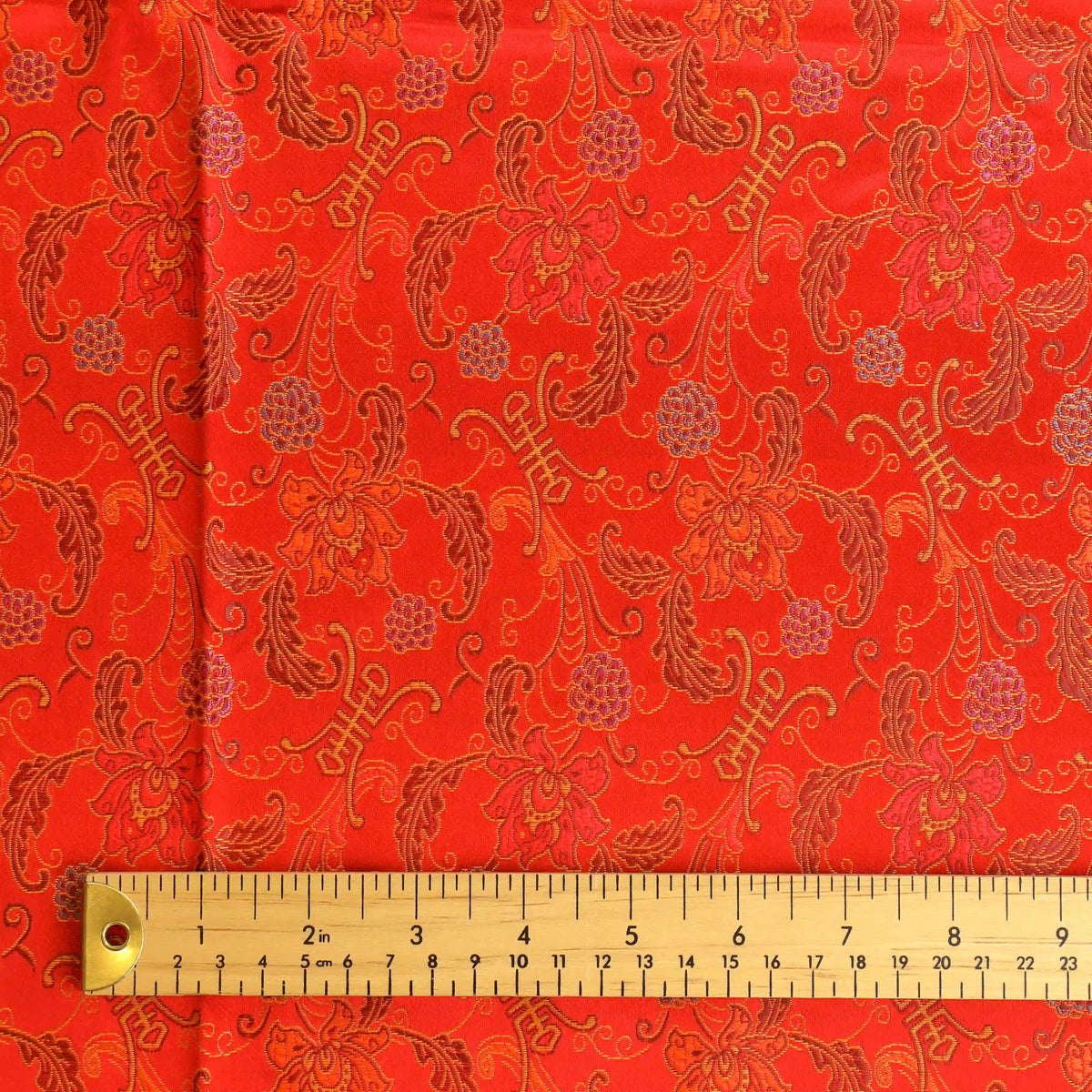 red-&-gold-floral-chinese-brocade-fabric – product gently folded showing its colour, texture and drape