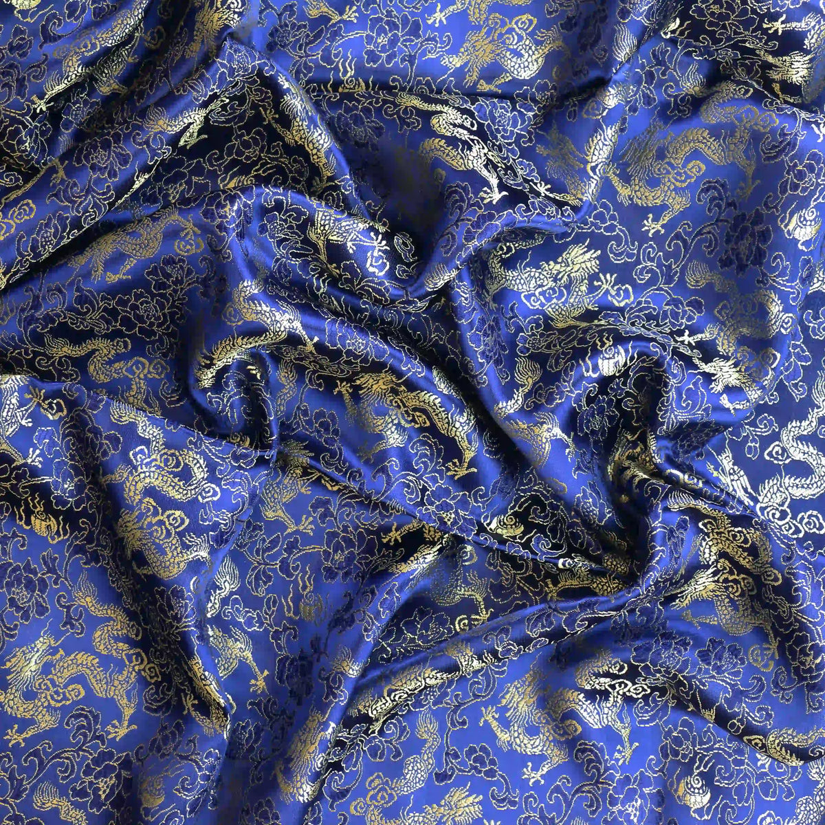 blue-&-gold-floral-dragon-jacquard-fabric – close-up of colour, pattern and texture