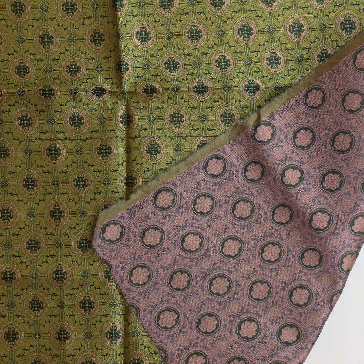 gold,-green-&-pink-geometric-brocade-fabric – close-up showing weave and surface detail