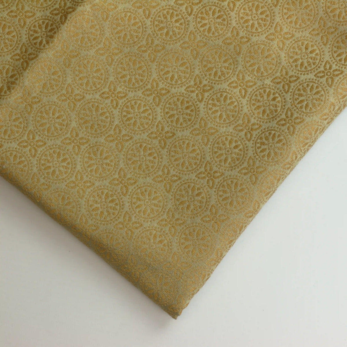 gold-geometric-floral-silk-jacquard-fabric – close-up of colour, pattern and texture