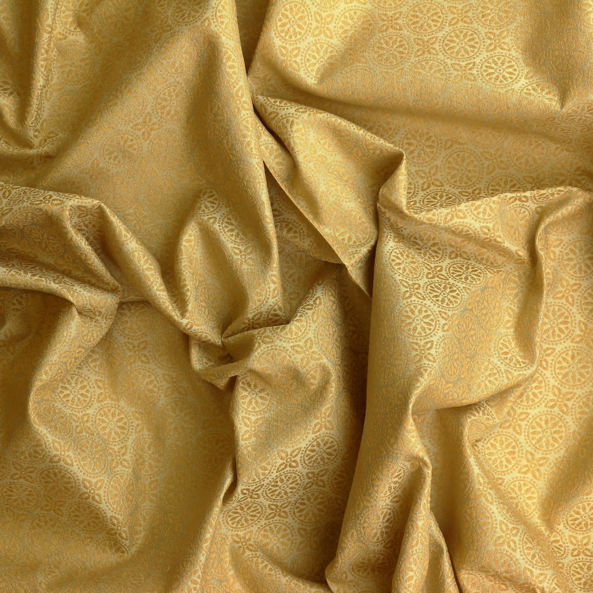 gold-geometric-floral-silk-jacquard-fabric – product gently folded showing its colour, texture and drape
