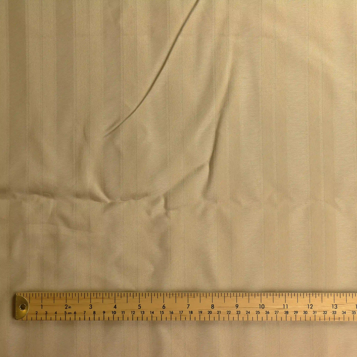 gold-jacquard-striped-home-decor-fabric-remnant – product gently folded showing its colour, texture and drape
