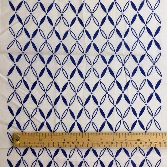 blue-&-white-geometric-print-fabric-panel – product gently folded showing its colour, texture and drape