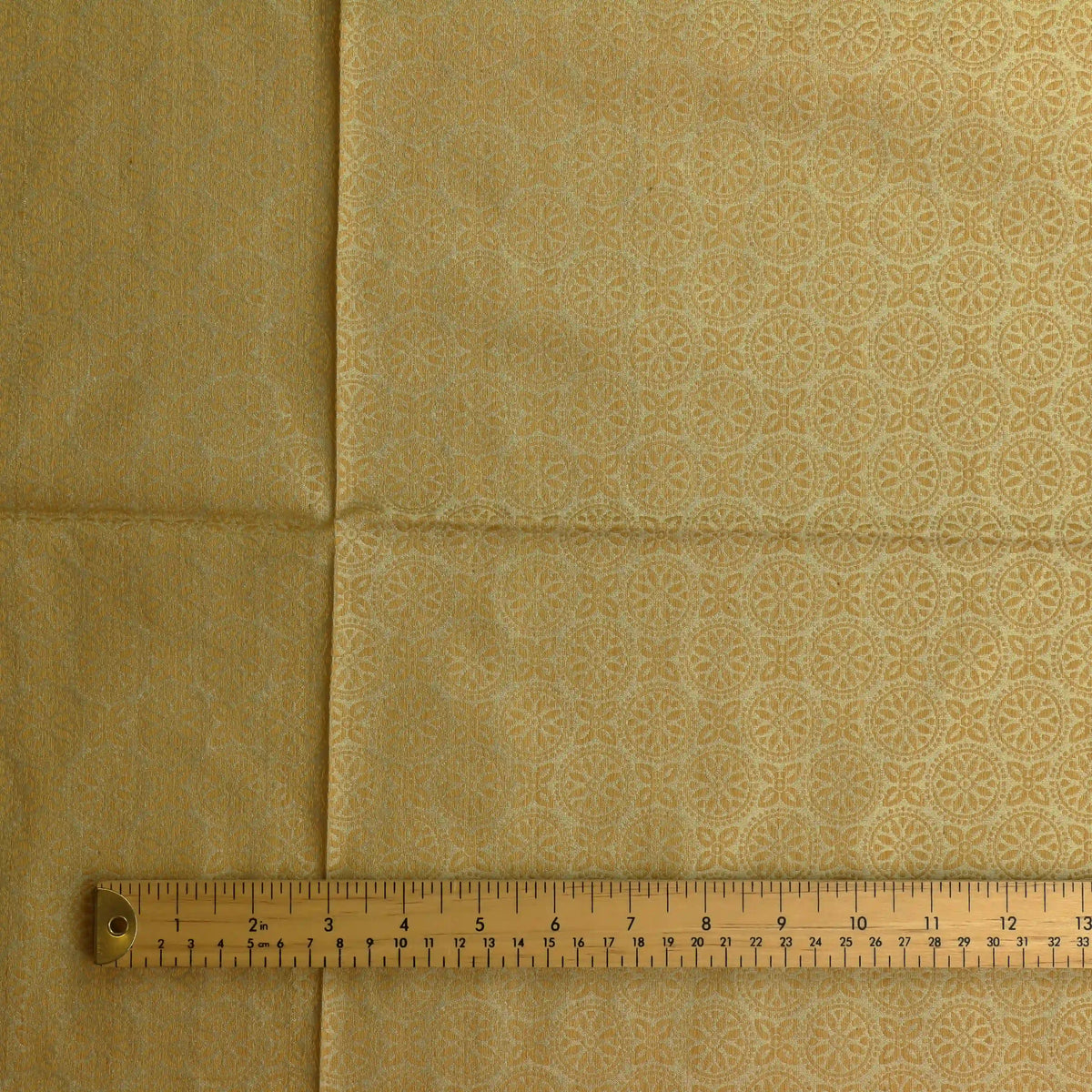 gold-geometric-floral-silk-jacquard-fabric – close-up showing weave and surface detail