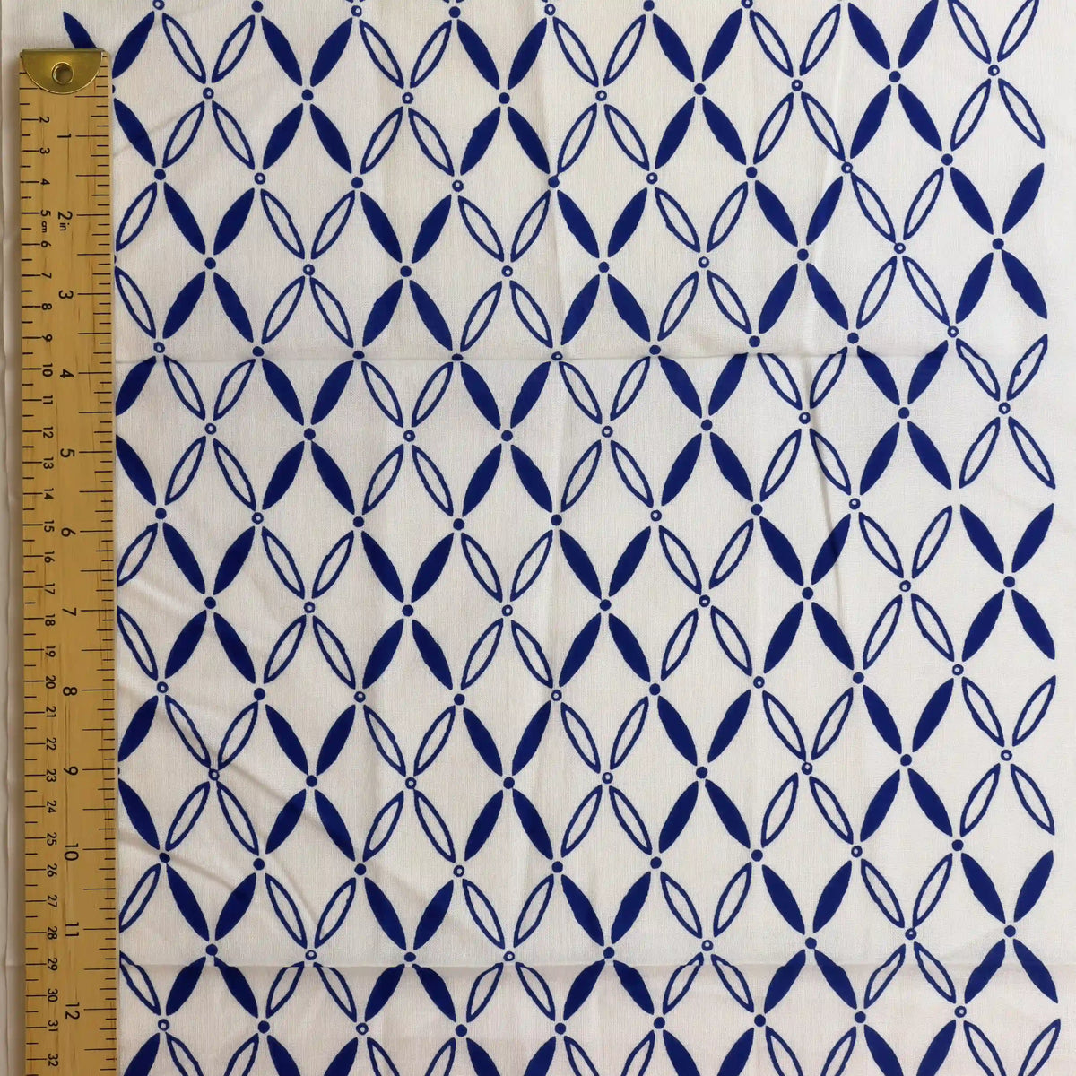 blue-&-white-geometric-print-fabric-panel – close-up showing weave and surface detail