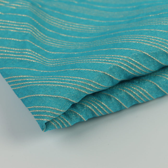 Turquoise & gold striped jacquard fabric folded showing detail