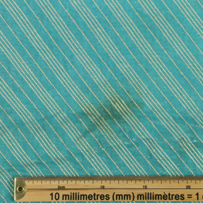 Turquoise & gold striped jacquard fabric details of mark