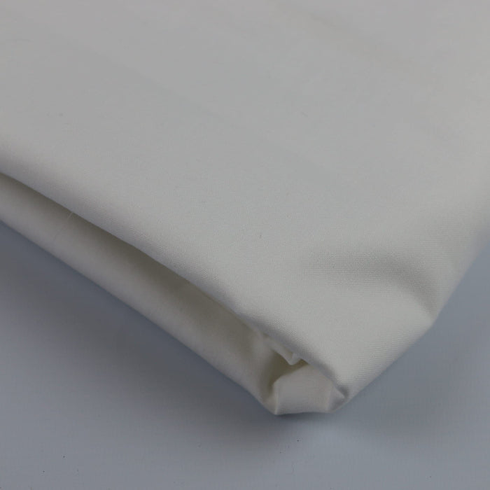 White cotton sheeting fabric folded showing detail