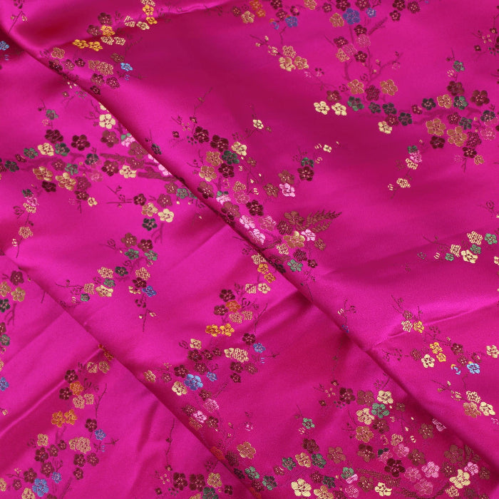 Hot pink cherry blossom jacquard fabric folded