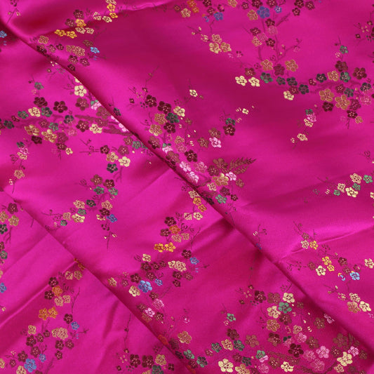 Hot pink cherry blossom jacquard fabric folded