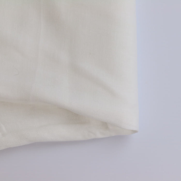 White Lightweight Muslin Fabric folded showing detail