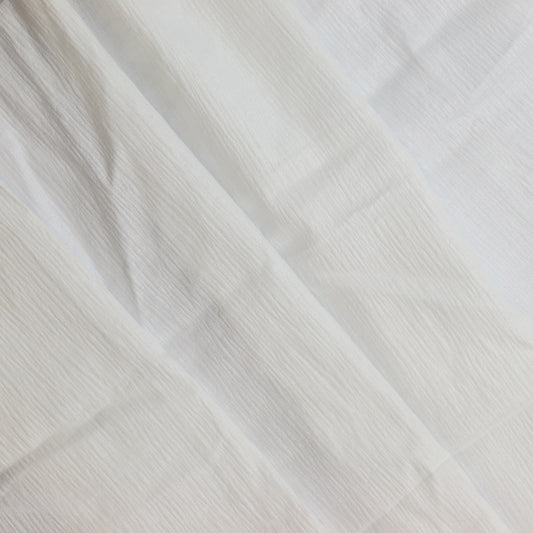 White poly-cotton crinkle fabric remnant folded