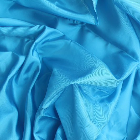 Turquoise Acetate Bengaline Fabric showing drape