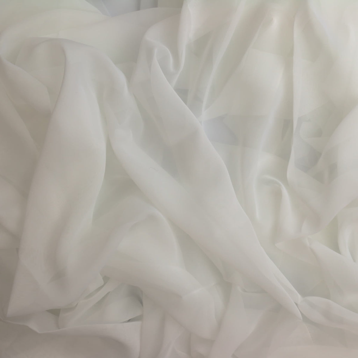 White polyester net curtain fabric showing drape