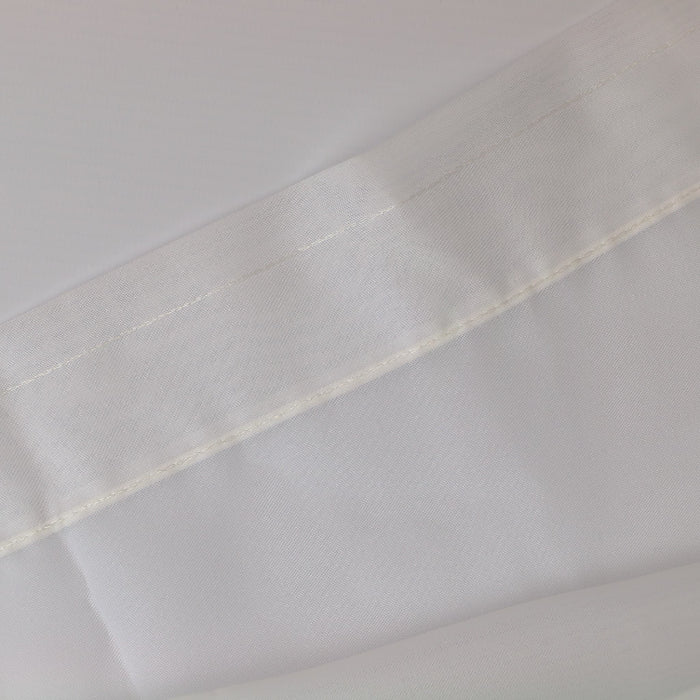 White polyester net curtain fabric laid flat