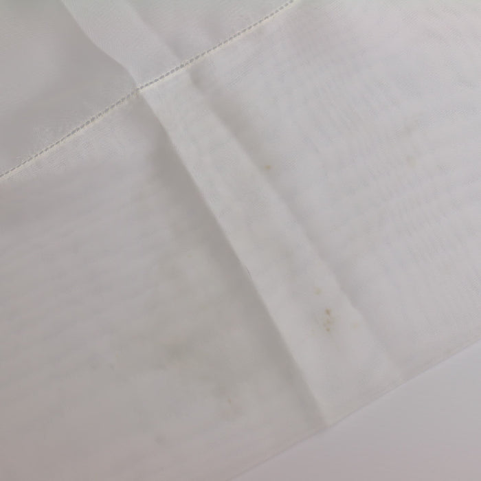 White polyester net curtain fabric showing detail