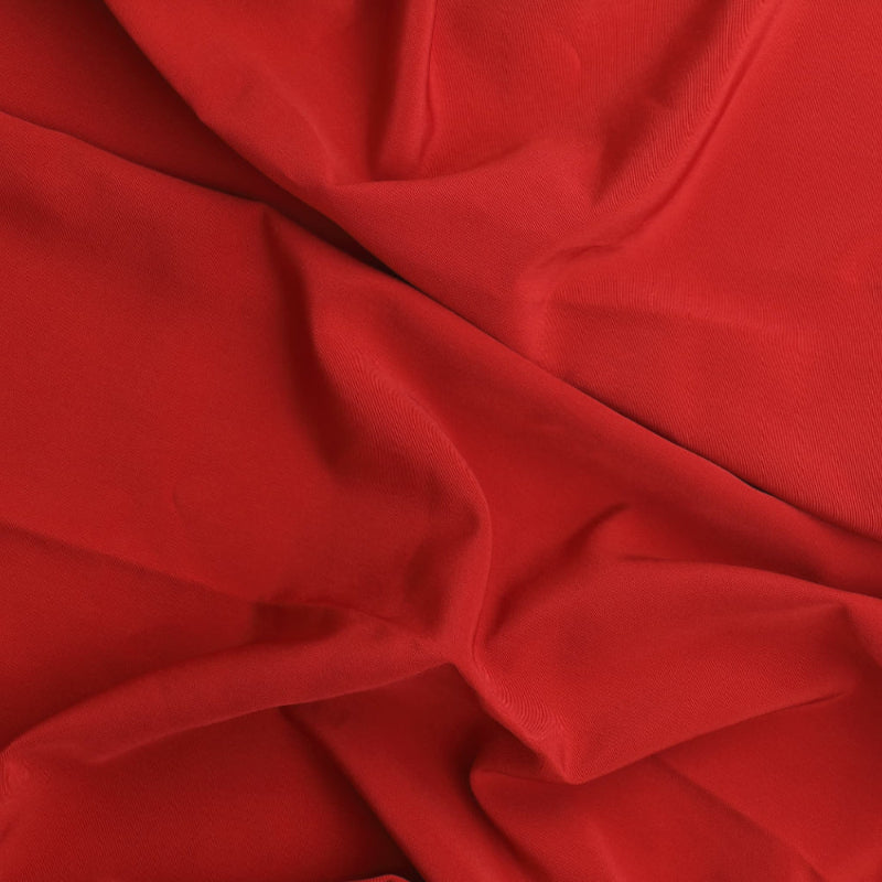 Red polyester twill lining fabric showing drape